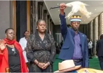 Raila Junior symbolically takes over his father’s political mantle with fly whisk and Jaramogi hat
